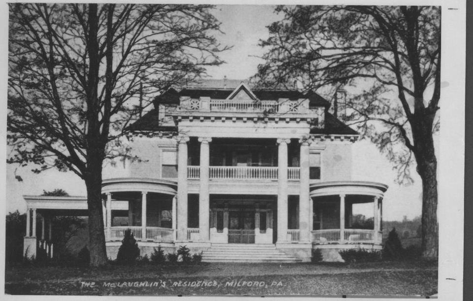 The aged photo reads “The McLaughin’s residence, Milford.” The building, which now houses the historical society and museum, has recently undergone rehabilitative construction on the porches, columns and soffits.